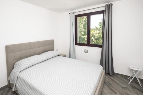 Postel nebo postele na pokoji v ubytování Sa lampana