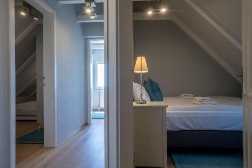 A bed or beds in a room at Perla Balaton