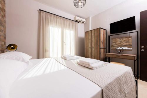 Ένα ή περισσότερα κρεβάτια σε δωμάτιο στο Arsenoi's Pool Villa