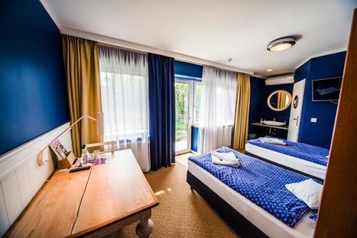 Postel nebo postele na pokoji v ubytování Hotel 4