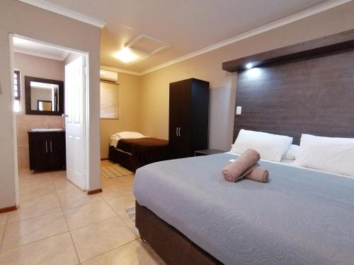 Un pat sau paturi într-o cameră la Goedehoop Guesthouse