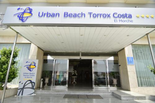 
a building with a sign on the front of it at Urban Beach Torrox Costa in Torrox Costa
