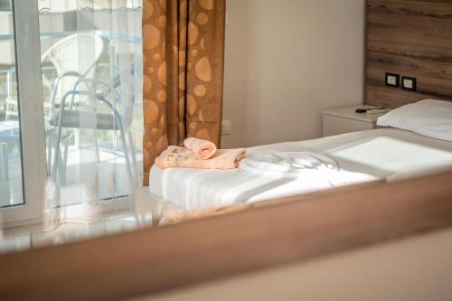 Postel nebo postele na pokoji v ubytování Hotel Kamomil