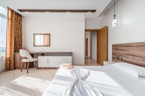 Postel nebo postele na pokoji v ubytování Hotel Kamomil