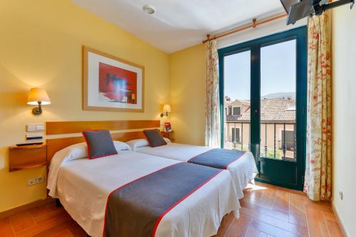 Katil atau katil-katil dalam bilik di Casa Rural La Chata by Vivere Stays