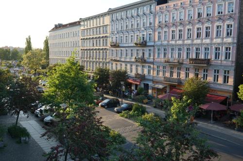 a large white building with a street in front of it at Brilliant Apartments in Berlin