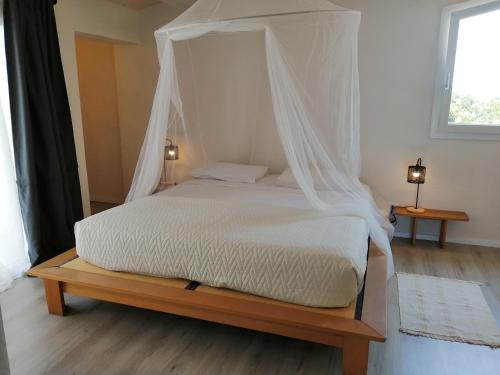 Giường trong phòng chung tại Poggio del Gallo