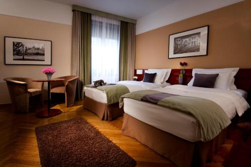 Letto o letti in una camera di Best Western Premier Hotel Slon