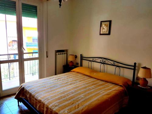 מיטה או מיטות בחדר ב-Nido del Gabbiano