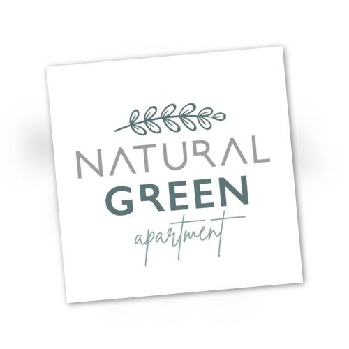 a sign for a natural green apartment with the words natural green apartment at Natural Green Apartment in Dhamnóni