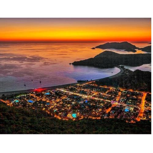 an aerial view of a city at night at İlkiz Beach Hotel in Oludeniz