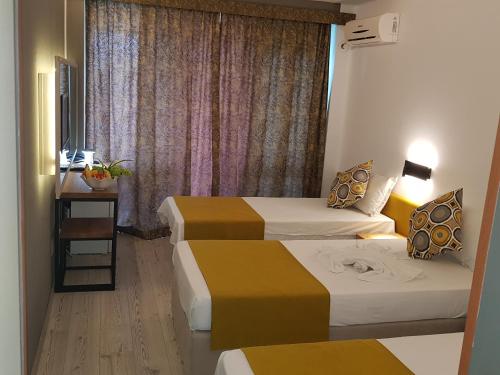 Ένα ή περισσότερα κρεβάτια σε δωμάτιο στο Tintyava Park Hotel