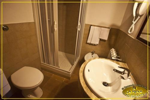 a bathroom with a sink and a shower and a toilet at Villa La Rena in Anagni