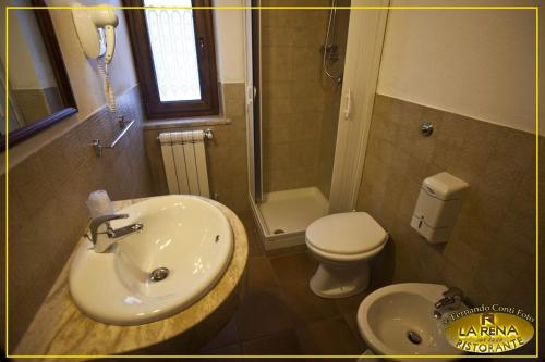 a bathroom with a sink and a toilet and a shower at Villa La Rena in Anagni