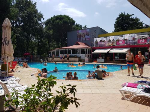 a group of people sitting in a swimming pool at Tintyava Park Hotel in Golden Sands