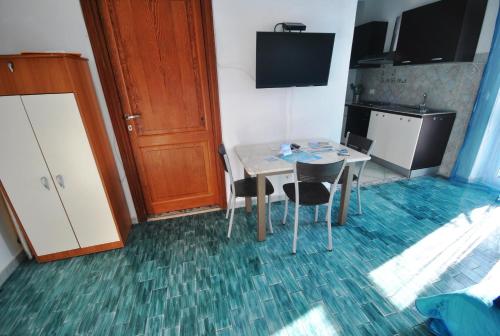 TV a/nebo společenská místnost v ubytování Holiday Residence Rifugio