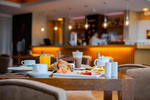 a table with a plate of food on it at VidaMar Resort Hotel Algarve in Albufeira