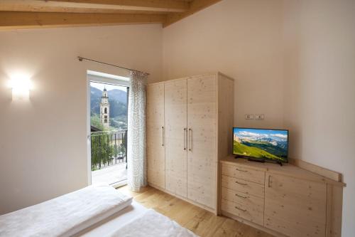 Voodi või voodid majutusasutuse Fiemme Home Mountain Apartment toas