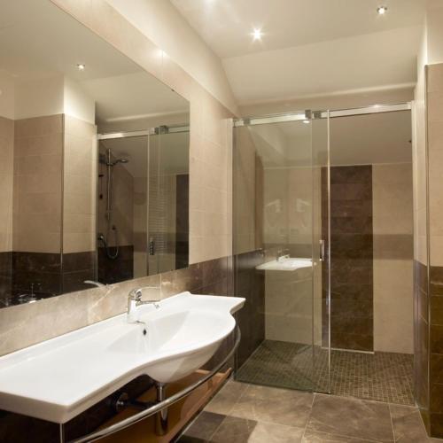 a bathroom with a sink and a shower at Virginia Palace Hotel in Garbagnate Milanese