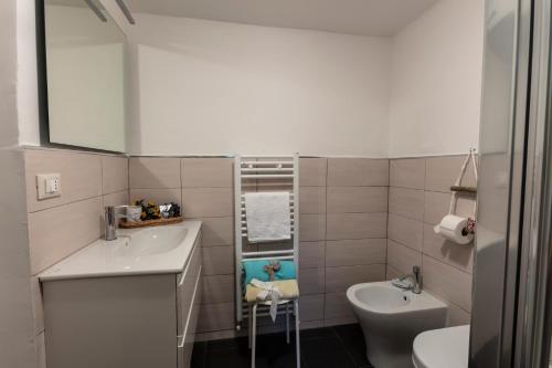 a small bathroom with a sink and a toilet at La BRIGNA B&B Il bosco sul mare in Genoa