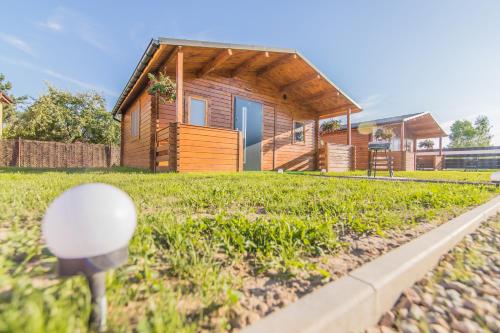 a house with a mirror in front of it at FamilyCamp in Zator