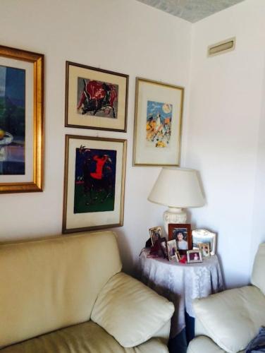 a living room with a couch and a table with a lamp at ALLEGROHOME your big nest in Barile