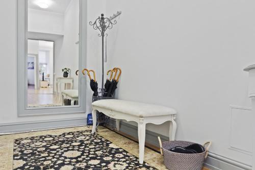 a dressing room with a stool and a mirror at Exclusive Charm of the Old Tallinn in Tallinn
