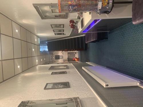 a large room with a kitchen with a stove at The Mornington Hotel in Blackpool