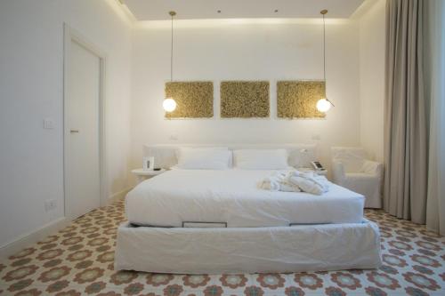 En eller flere senger på et rom på Villa Ascosa - Relais sul Mare
