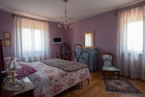 Postel nebo postele na pokoji v ubytování B&B Pino Cedro