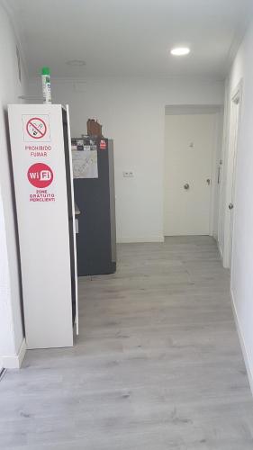 an empty room with a sign in the middle of it at Casa Botes in Cuenca