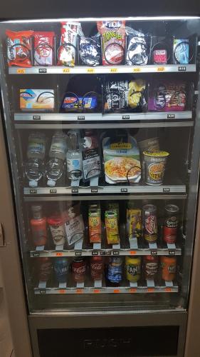 a refrigerator filled with lots of different types of food at Casa Botes in Cuenca