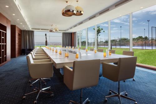 a large conference room with a long table and chairs at Marchica Lagoon Resort in Nador