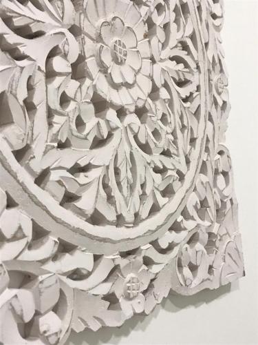 a close up of a wooden carving of a flower at Porta 20 in Loulé