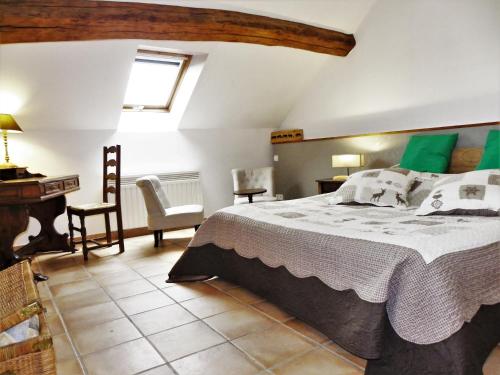 Un ou plusieurs lits dans un hébergement de l'établissement Le Cottage du Château