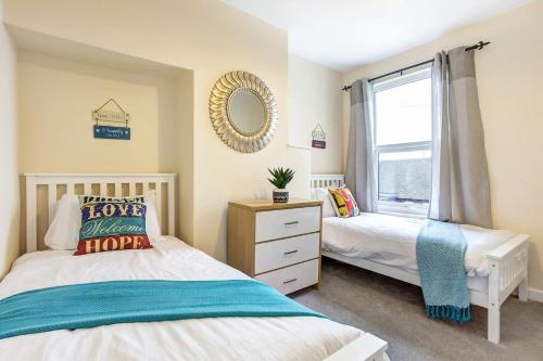 Postel nebo postele na pokoji v ubytování Cloud View Cottage