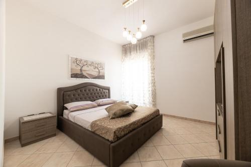 Ένα ή περισσότερα κρεβάτια σε δωμάτιο στο CASA VACANZA SALENTO MIREA