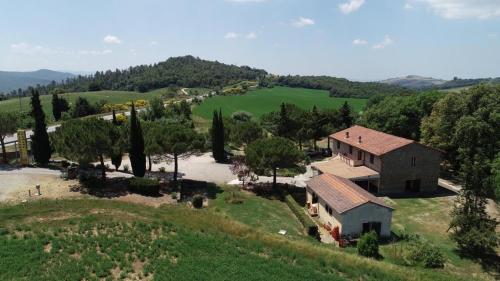 an aerial view of a house on a hill at Locanda il Boschetto in Volterra