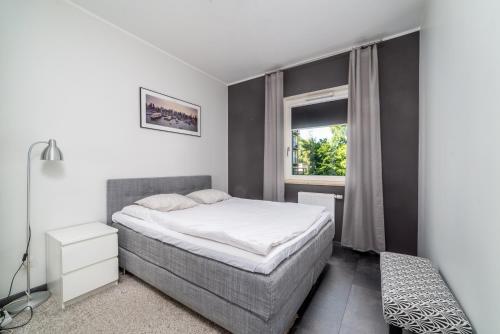 En eller flere senge i et værelse på Dalilah Apartment - Hav Aparts