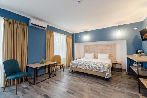 Una cama o camas en una habitación de Gvino Minda