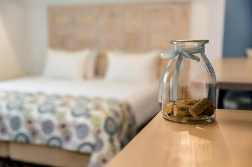 Una cama o camas en una habitación de Gvino Minda