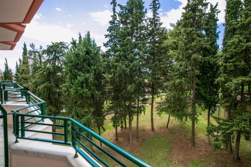 a view from the balcony of a house with trees at Hotel Pella in Giannitsa