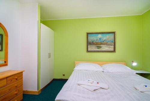 Postel nebo postele na pokoji v ubytování Hotel Max