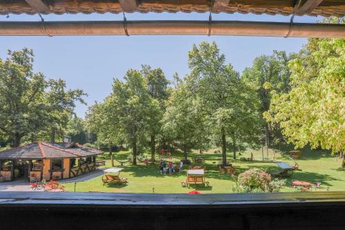 a view of a park from a window at Penzion Pibernik in Bled