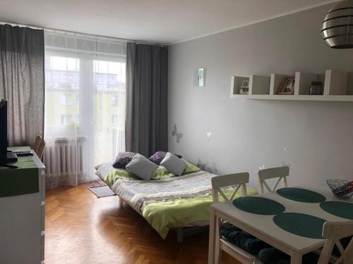 Posteľ alebo postele v izbe v ubytovaní Apartament Przymorze