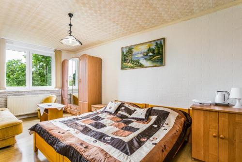 Postel nebo postele na pokoji v ubytování Dom Gościnny Marcela