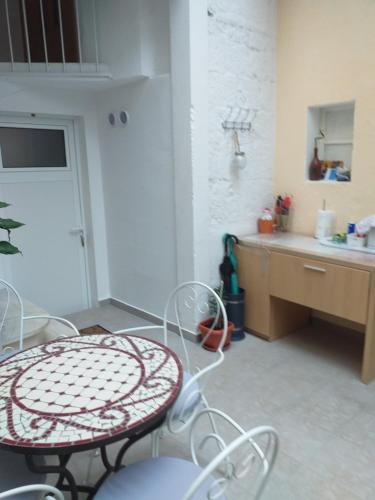 a kitchen with a table and chairs in a room at Apartments Ivica Split in Split