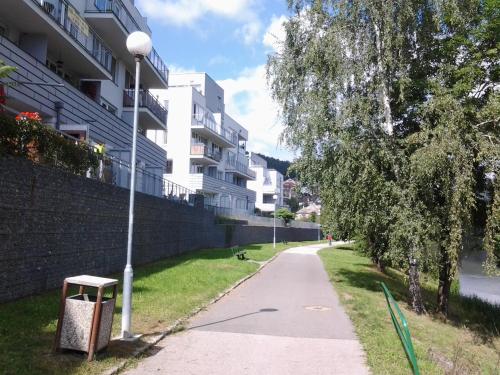 a street light on a sidewalk next to a building at Apartmán Residence Nábřeží in Beroun