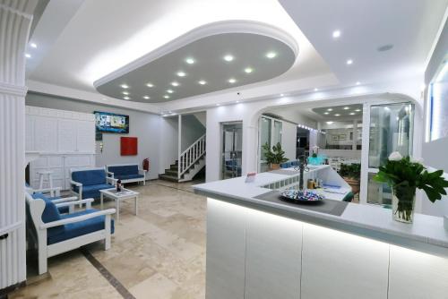 a living room with a reception counter and a waiting room at Limnia Gi in Mirina