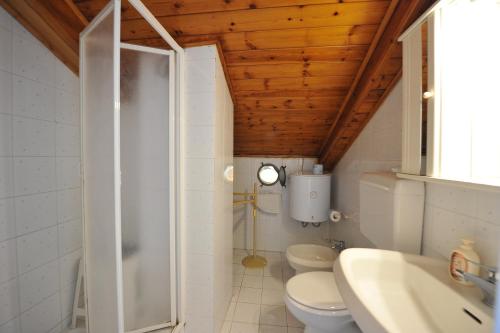 a bathroom with a shower and a toilet and a sink at Villa Walter in Sorrento